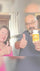 Two people giving thumbs up, one holding a bottle of supplements.